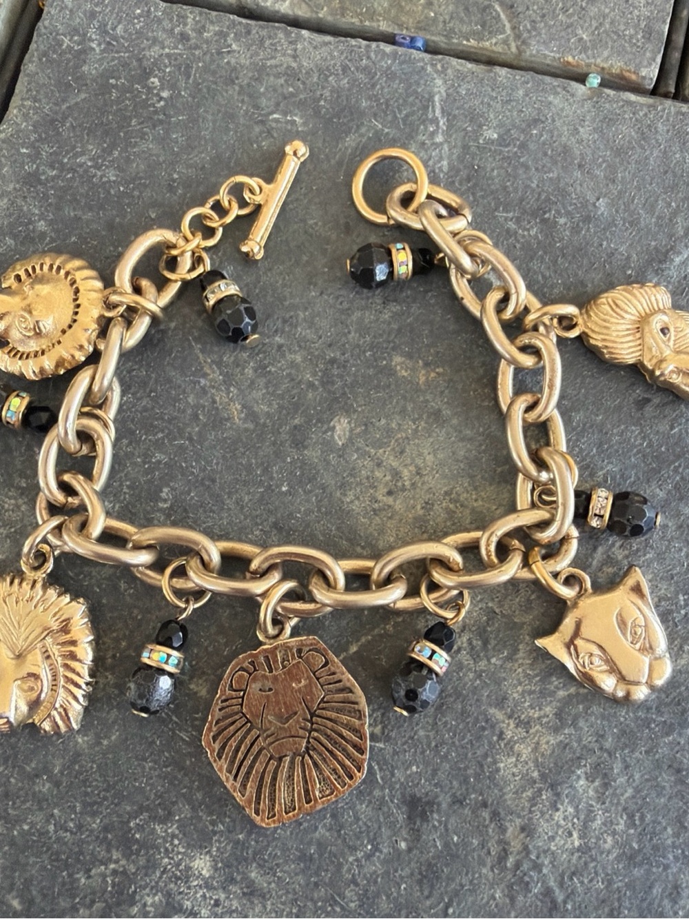 Vintage Disney Lion King Gold-Tone BroadwayCharm Bracelet with Black Bead Accent